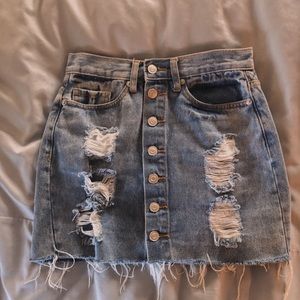a trendy ripped jean skirt